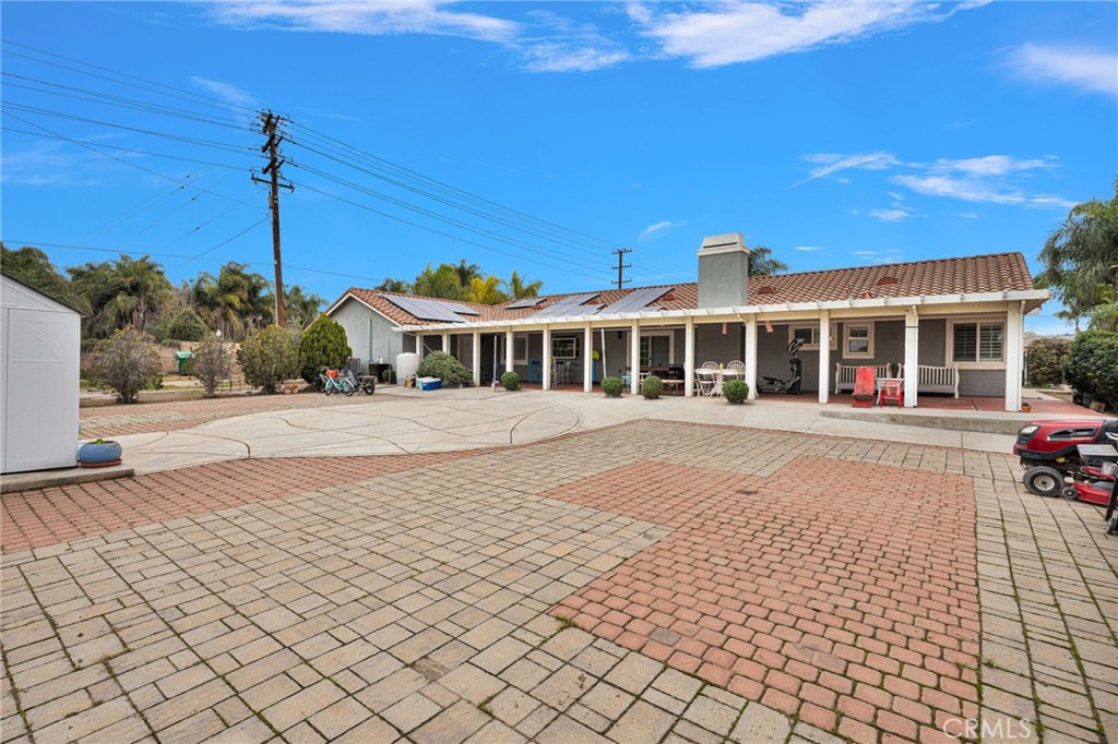 17777 Brazier Drive Riverside, CA 92508 - Photo 39 of 58 a front view of a building with a yard