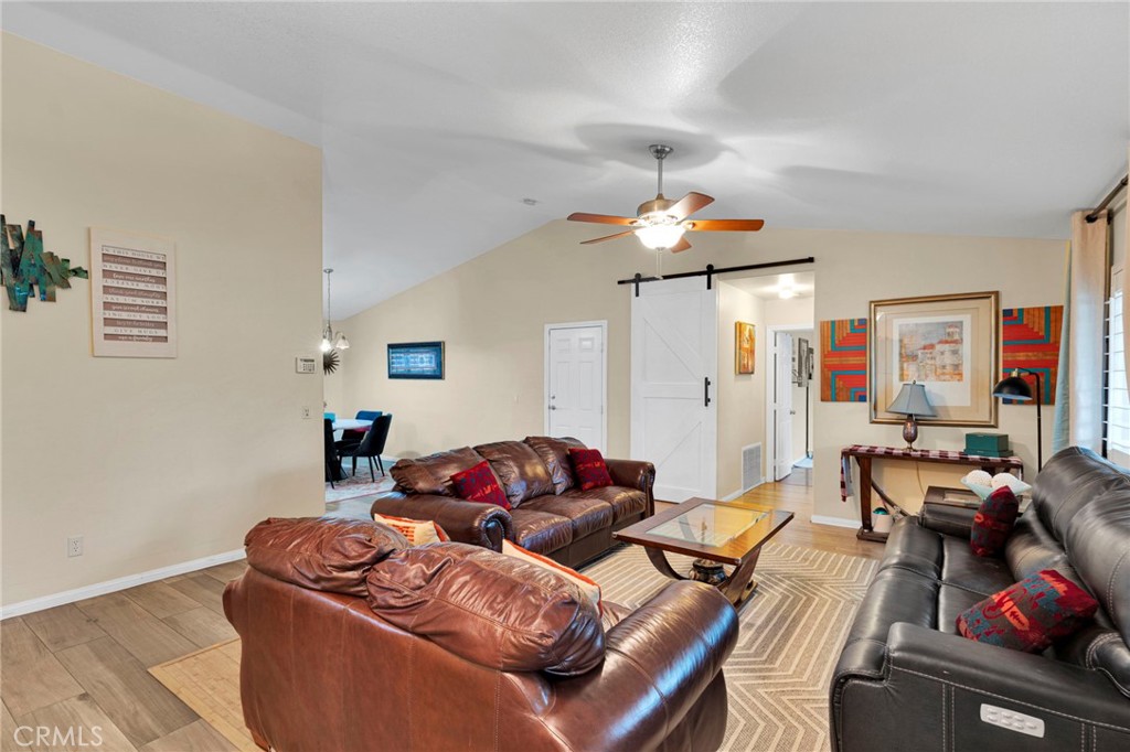 17777 Brazier Drive Riverside, CA 92508 - Photo 9 of 58 a living room with furniture a couch and a chandelier