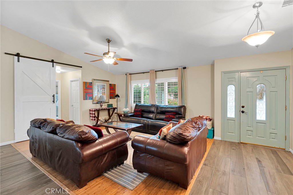 17777 Brazier Drive Riverside, CA 92508 - Photo 10 of 58 a living room with furniture and a chandelier