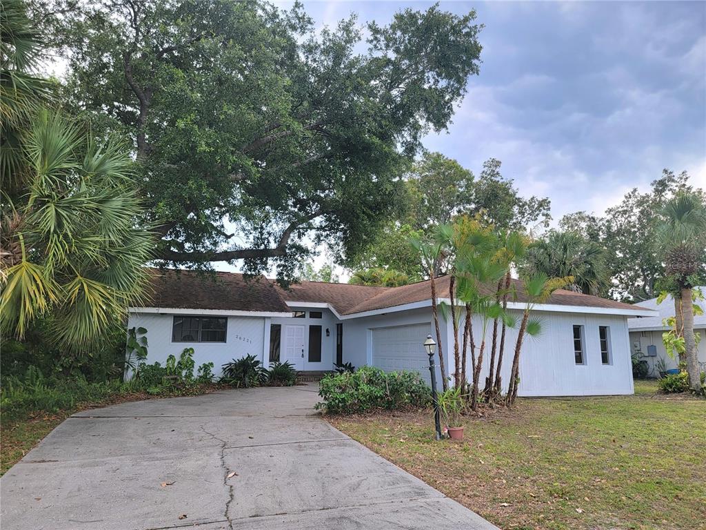 26221 Constantine Road Punta Gorda, FL 33983 - Photo 6 of 27 a front view of a house with garden