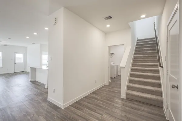 a view of entryway with wooden floor