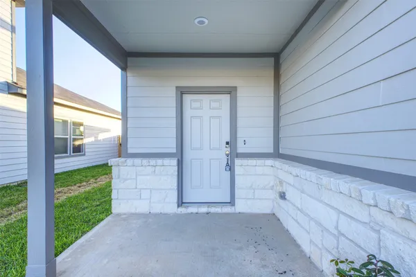 a view of house with backyard