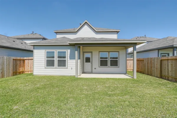 a house that has a big yard in front of it