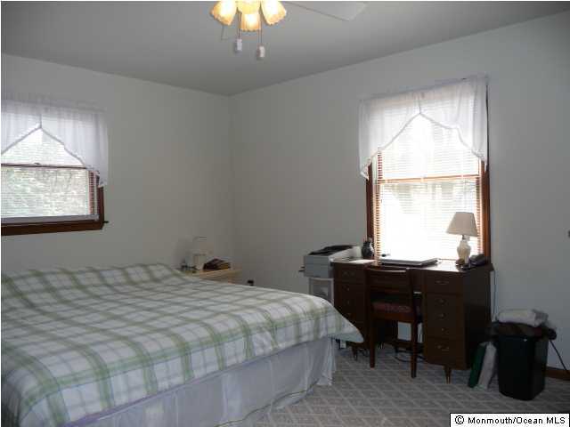 591 Route 539 Cream Ridge, NJ 08514 - Photo 3 of 3 a bedroom with a bed and a table