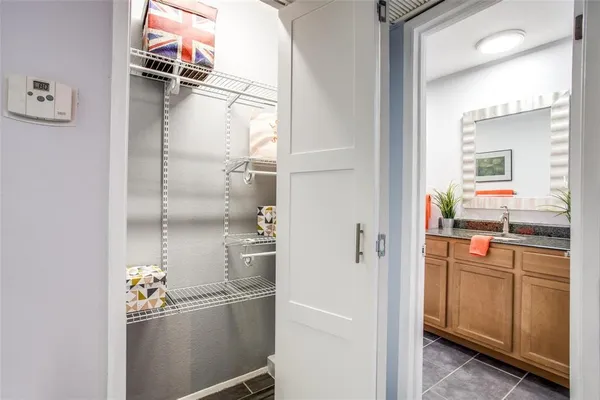 a kitchen with a refrigerator and cabinets