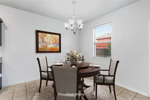 a dining room with furniture and window