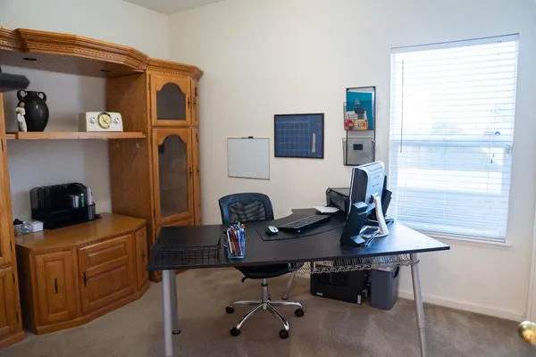 a view of a workspace with furniture
