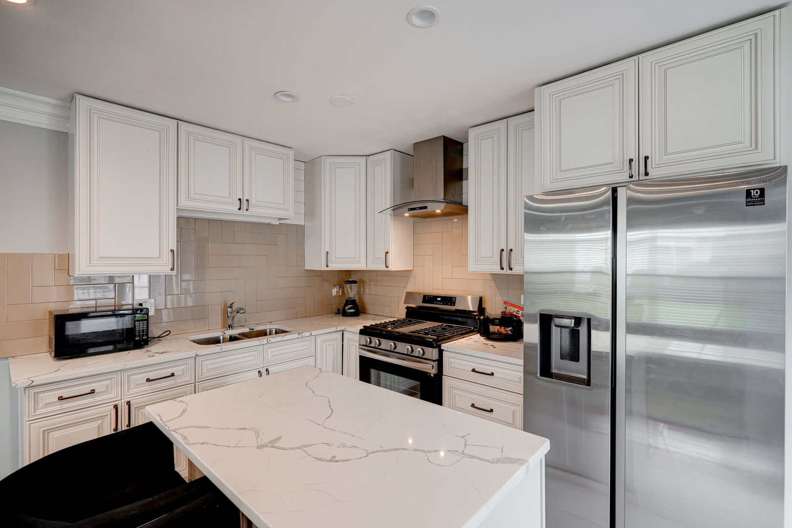 166 Williamsburg Road Country Club Hills, IL 60478 - Photo 3 of 15 a kitchen with cabinets stainless steel appliances and a counter space