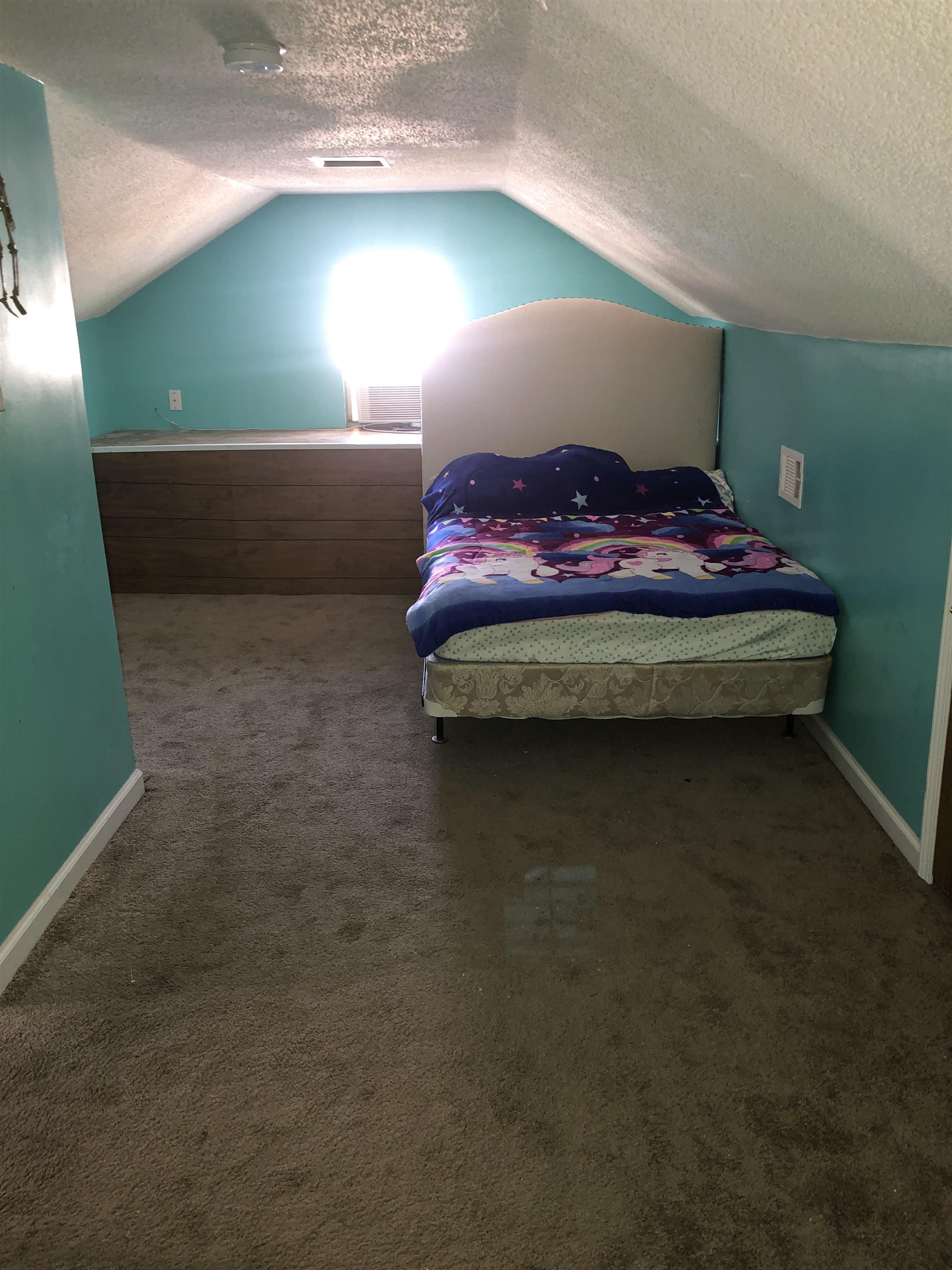 1441 Duke Road Memphis, TN 38122 - Photo 13 of 19 a bed sitting in a bedroom next to a window