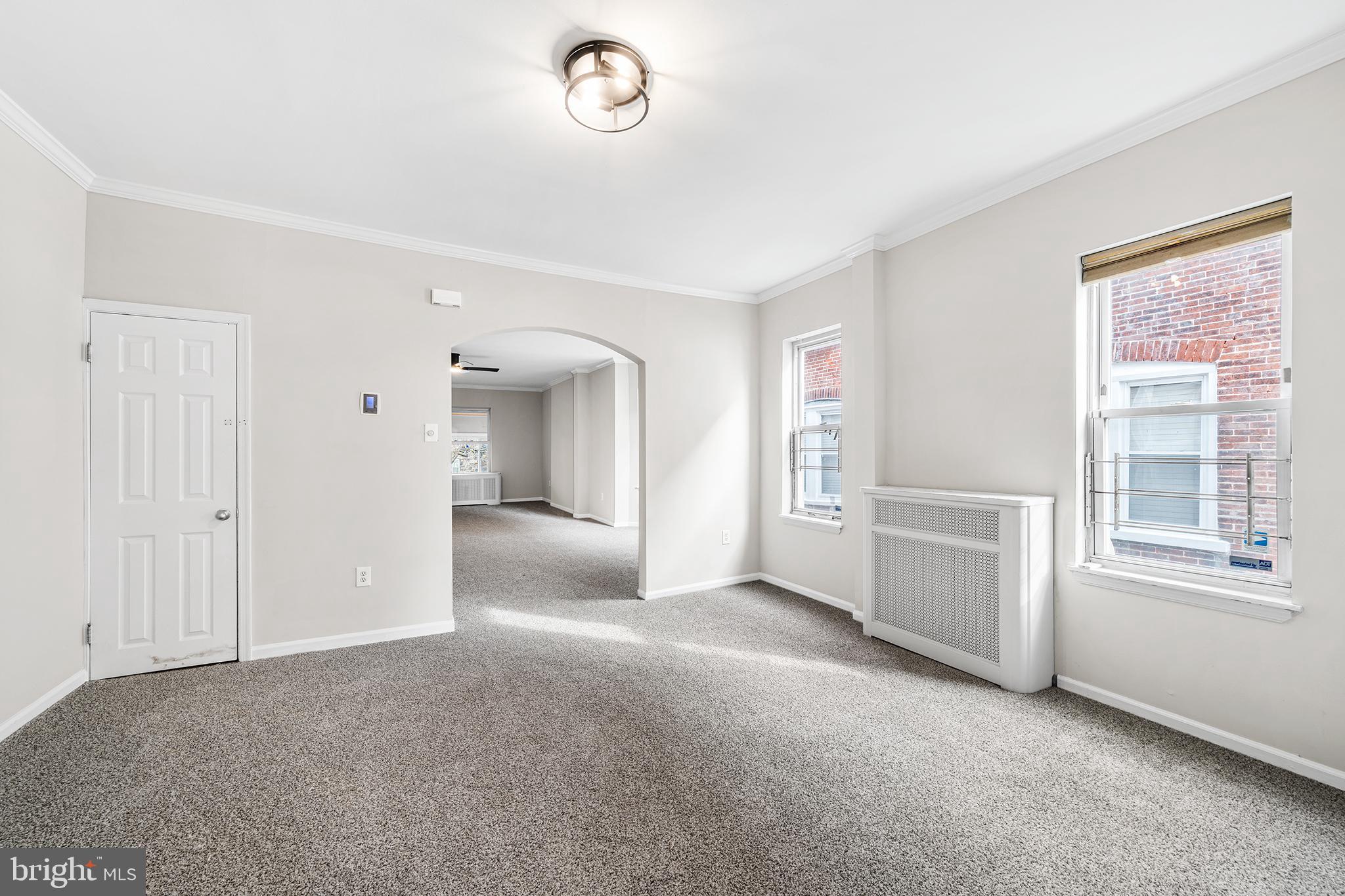 1006 Highland Avenue Chester, PA 19013 - Photo 12 of 29 a view of a livingroom with an empty space and a window