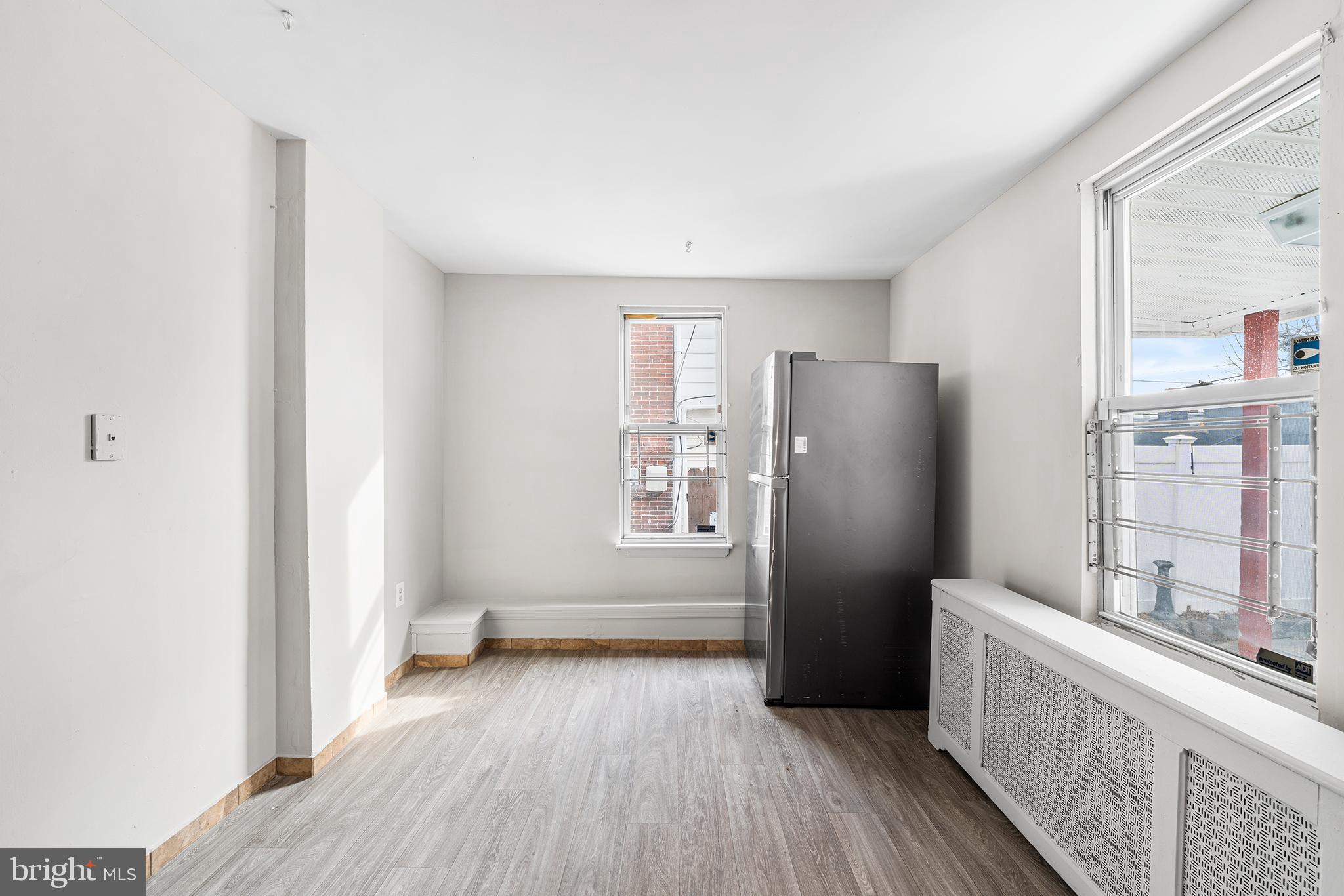 1006 Highland Avenue Chester, PA 19013 - Photo 15 of 29 a view of kitchen with refrigerator stove and wooden floor