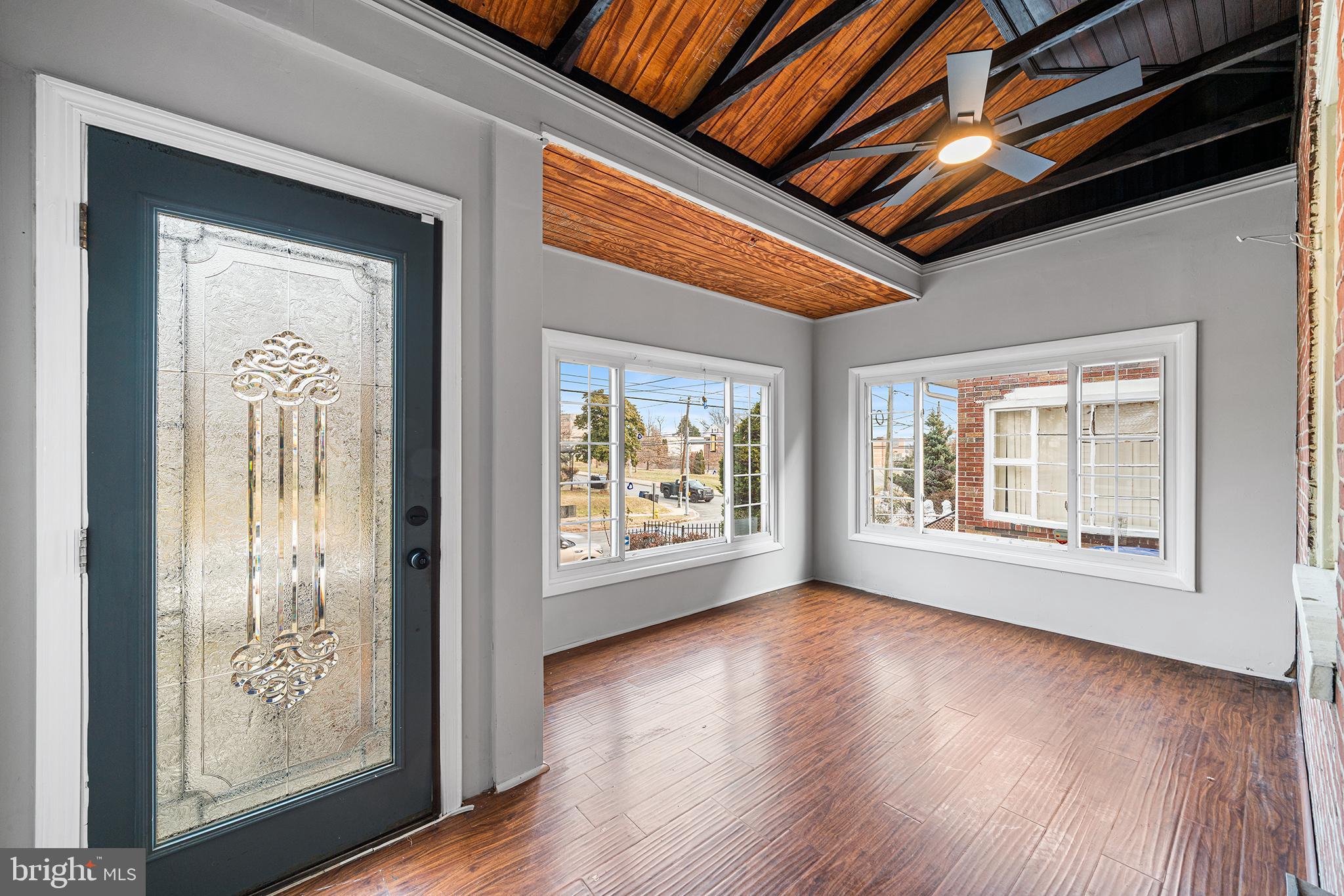 1006 Highland Avenue Chester, PA 19013 - Photo 4 of 29 a view of an empty room with wooden floor and a window