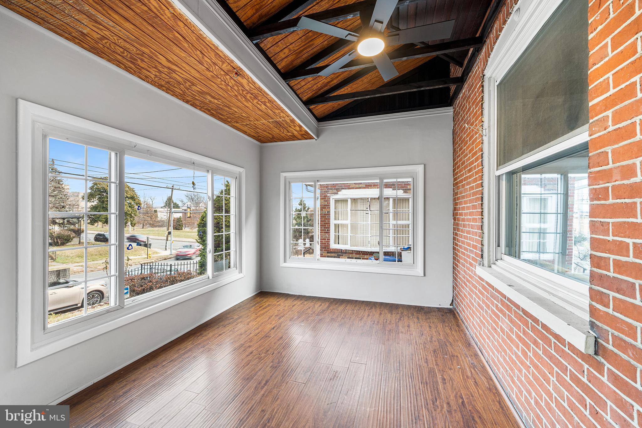 1006 Highland Avenue Chester, PA 19013 - Photo 5 of 29 a view of an empty room with wooden floor and a window