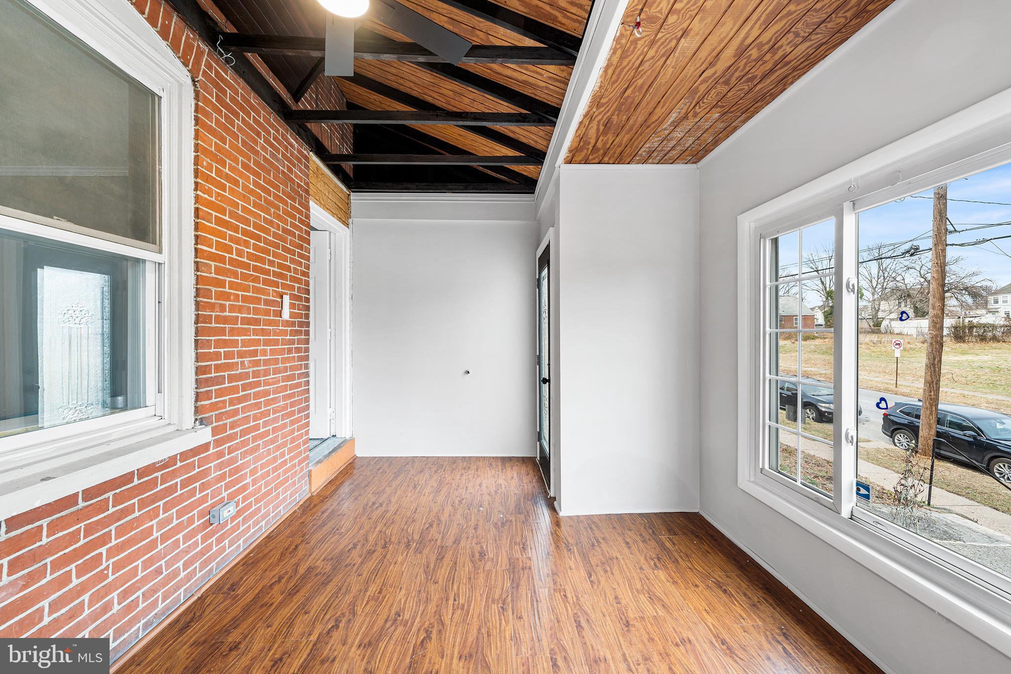 1006 Highland Avenue Chester, PA 19013 - Photo 6 of 29 a view of an empty room with wooden floor and a window