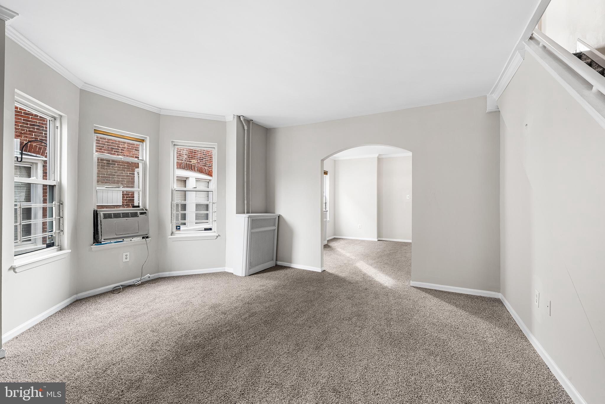 1006 Highland Avenue Chester, PA 19013 - Photo 9 of 29 an empty room with windows and entrance