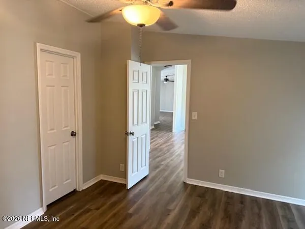 a view of a livingroom from a hallway