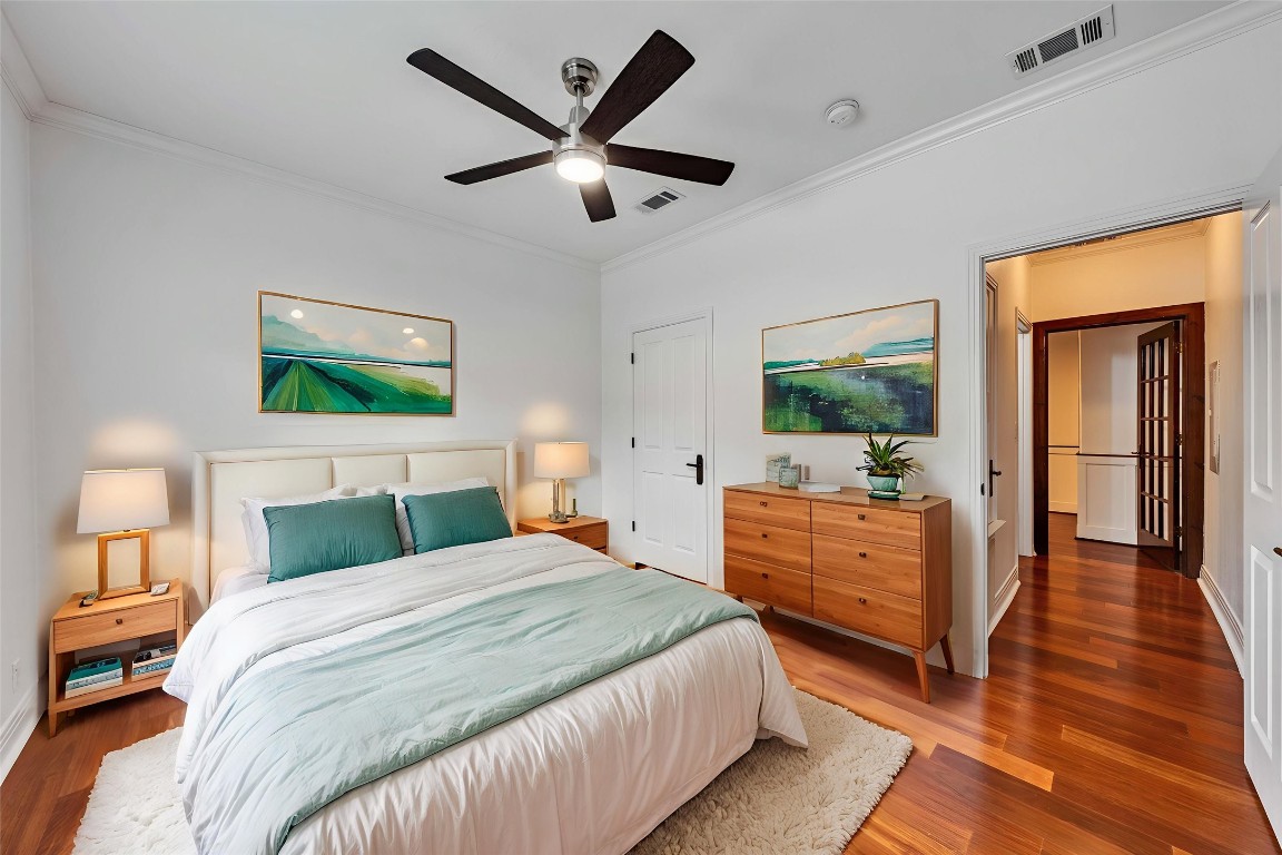 2108 Indian Creek Road Austin, TX 78734 - Photo 18 of 40 Bedroom featuring crown molding, wood finished floors, and a ceiling fan