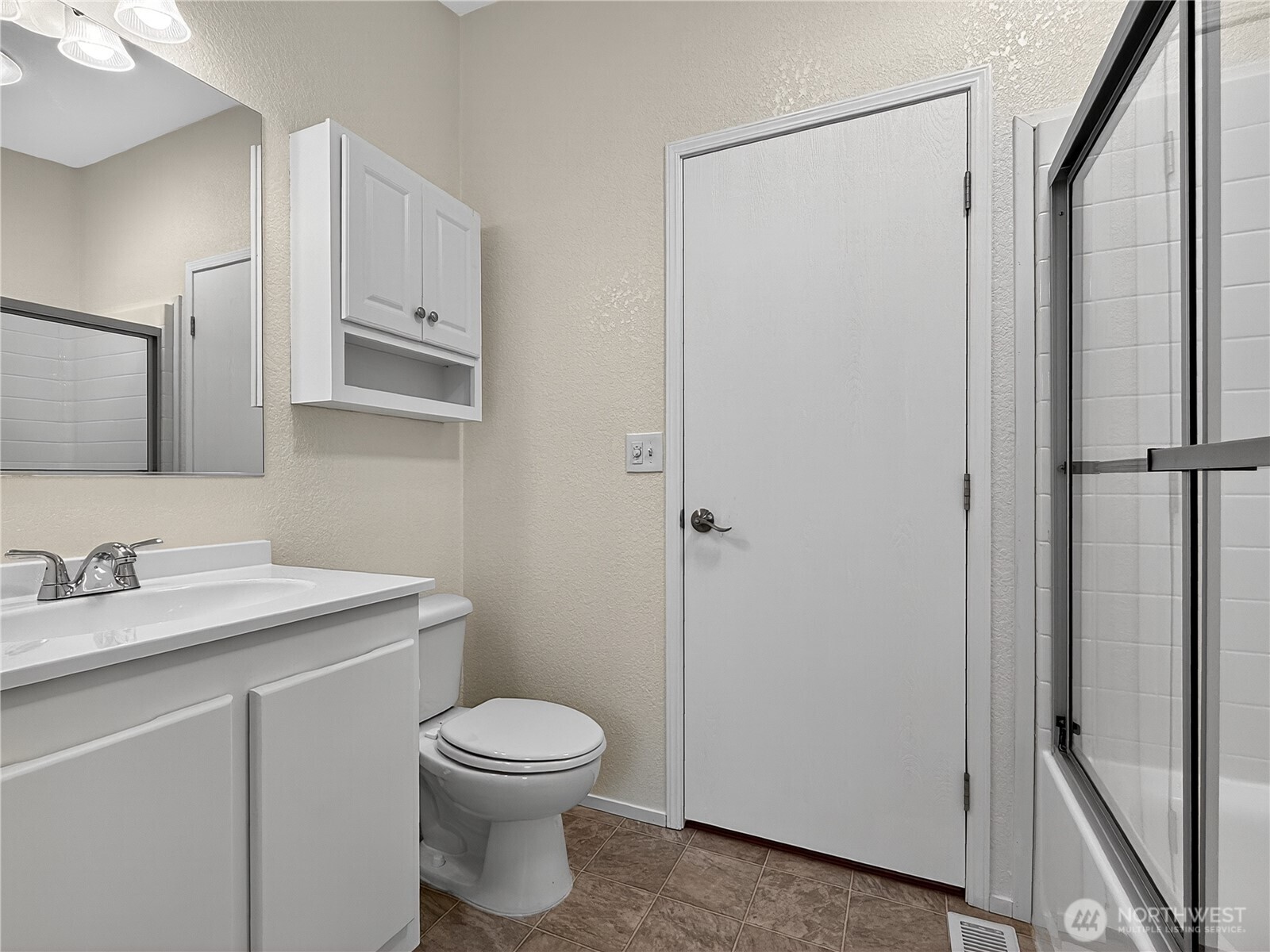 23825 15th Avenue Southeast, Unit 183 Bothell, WA 98021 - Photo 15 of 29 a bathroom with a toilet a sink and a mirror