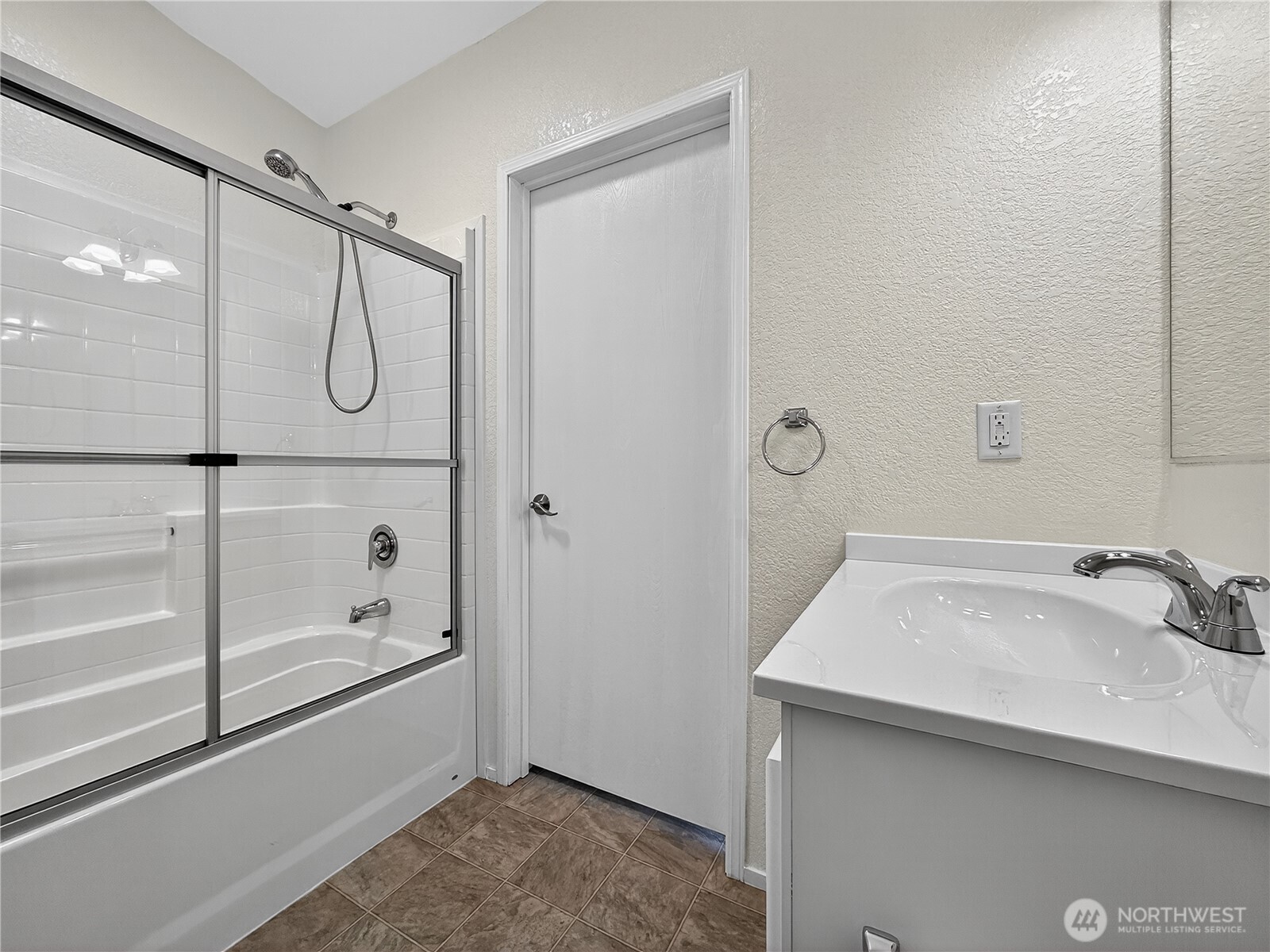 23825 15th Avenue Southeast, Unit 183 Bothell, WA 98021 - Photo 16 of 29 a bathroom with a shower sink and mirror