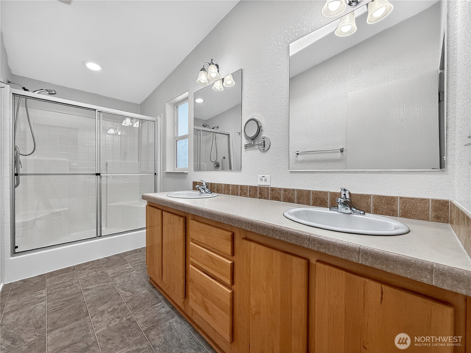 23825 15th Avenue Southeast, Unit 183 Bothell, WA 98021 - Photo 23 of 29 a spacious bathroom with double sink and a mirror
