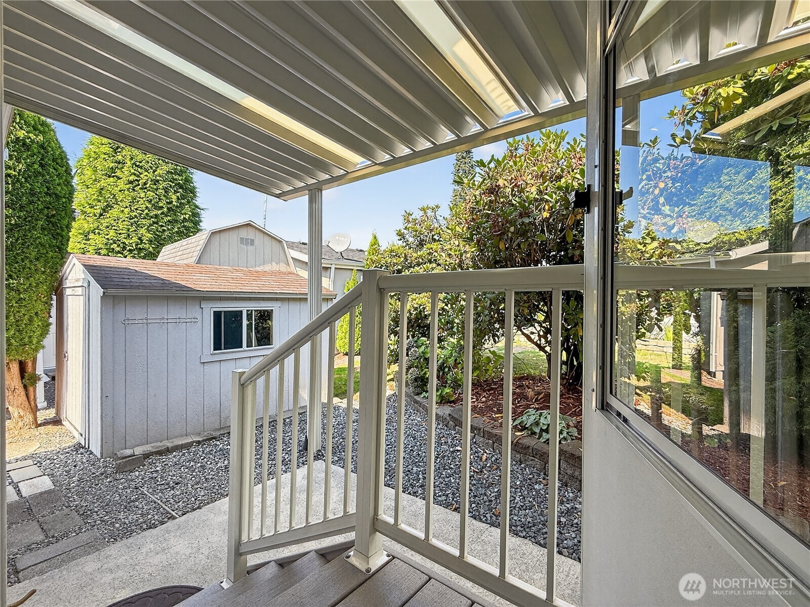 23825 15th Avenue Southeast, Unit 183 Bothell, WA 98021 - Photo 26 of 29 a view of a balcony with a large window and wooden floor