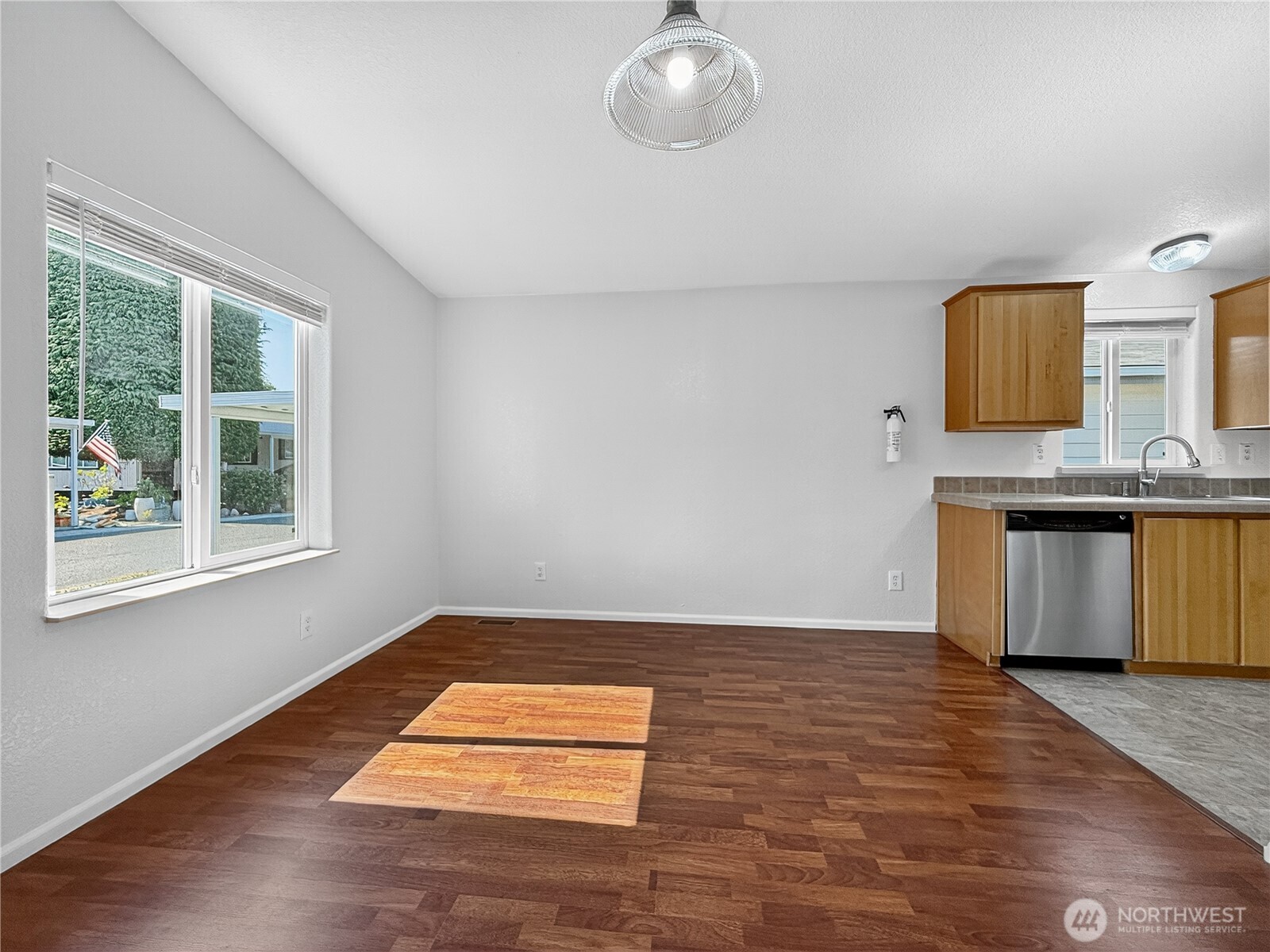 23825 15th Avenue Southeast, Unit 183 Bothell, WA 98021 - Photo 10 of 29 a view of kitchen with a sink wooden cabinets and a window