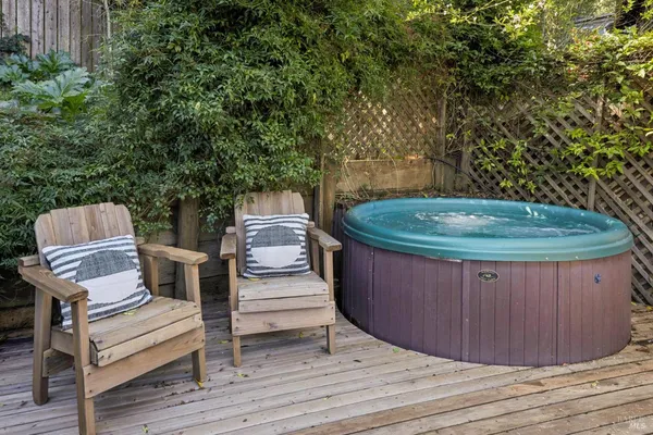 a wooden bench sitting in the middle of a backyard