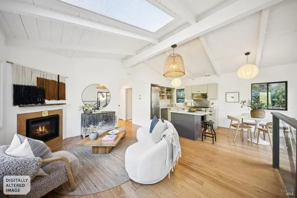 a living room with furniture fireplace and a flat screen tv