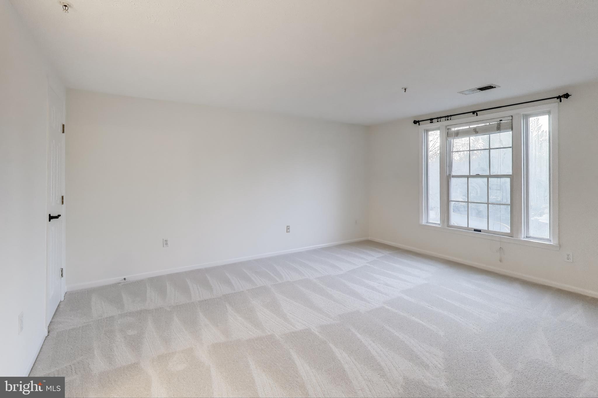 13107 Briarcliff Terrace, Unit 2204 Germantown, MD 20874 - Photo 14 of 30 a view of an empty room with a window