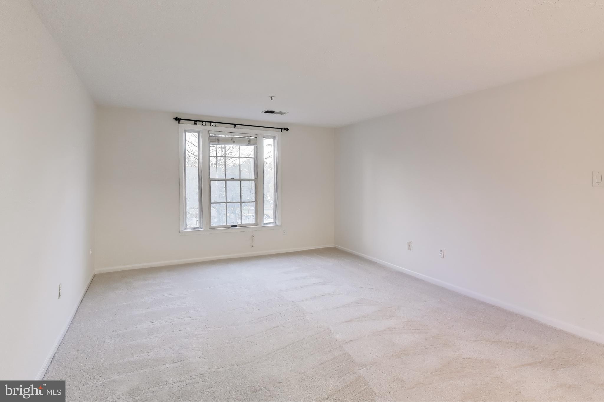 13107 Briarcliff Terrace, Unit 2204 Germantown, MD 20874 - Photo 15 of 30 an empty room with windows