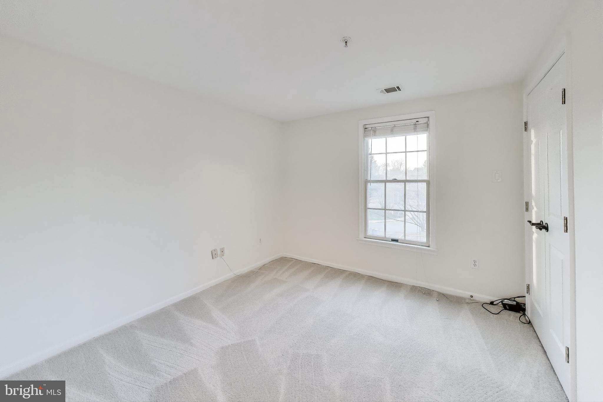 13107 Briarcliff Terrace, Unit 2204 Germantown, MD 20874 - Photo 20 of 30 an empty room with windows