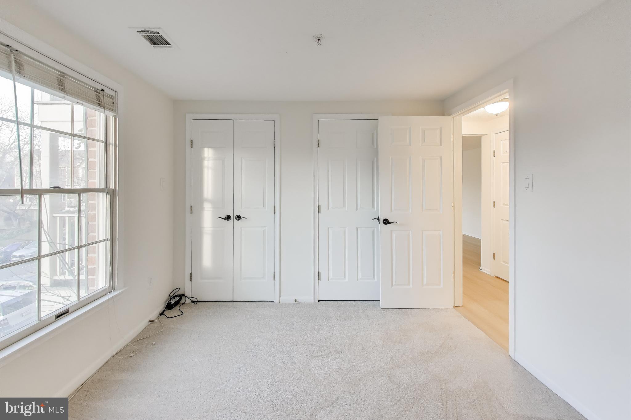 13107 Briarcliff Terrace, Unit 2204 Germantown, MD 20874 - Photo 22 of 30 a view of an empty room with a window