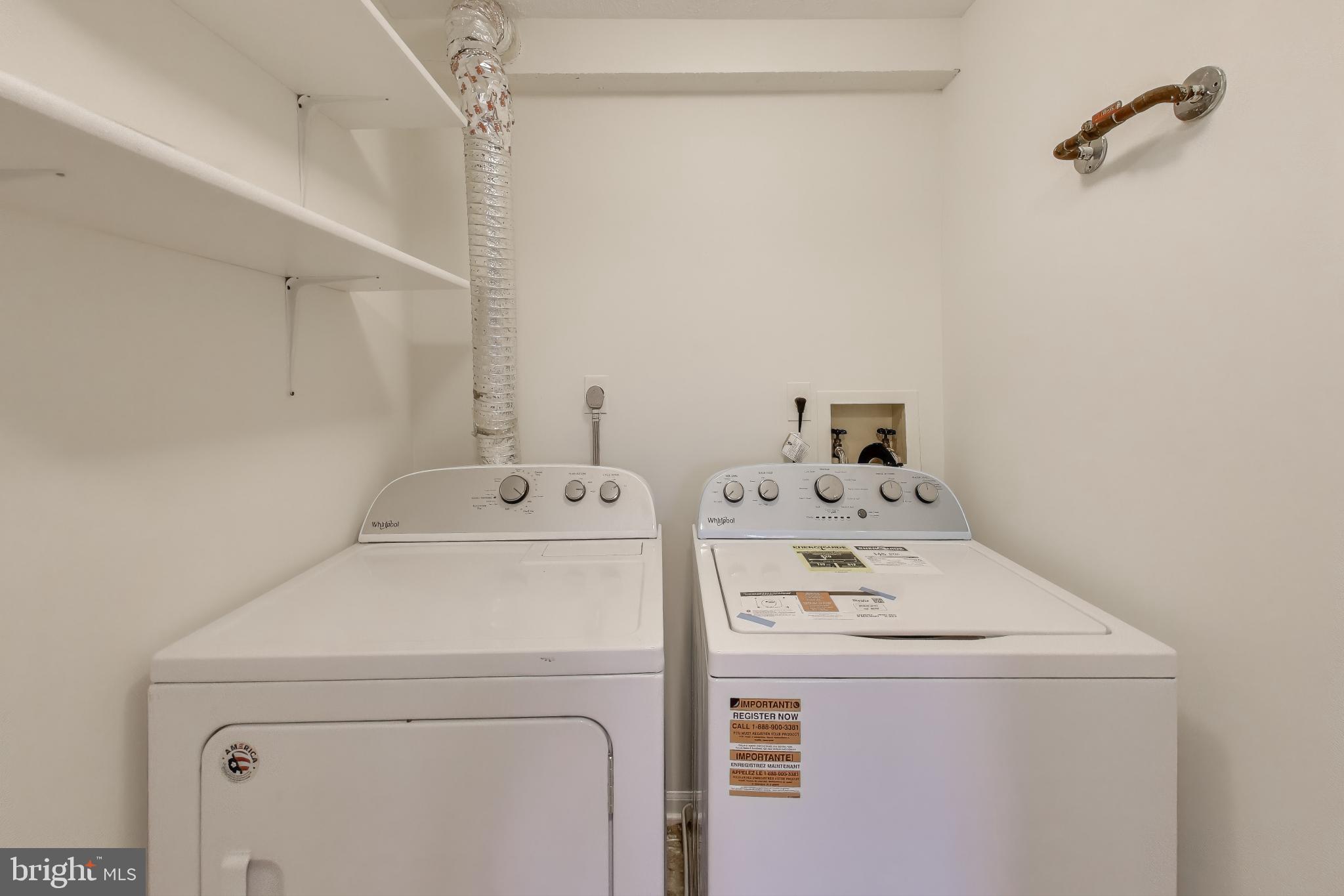 13107 Briarcliff Terrace, Unit 2204 Germantown, MD 20874 - Photo 25 of 30 a utility room with dryer and washer