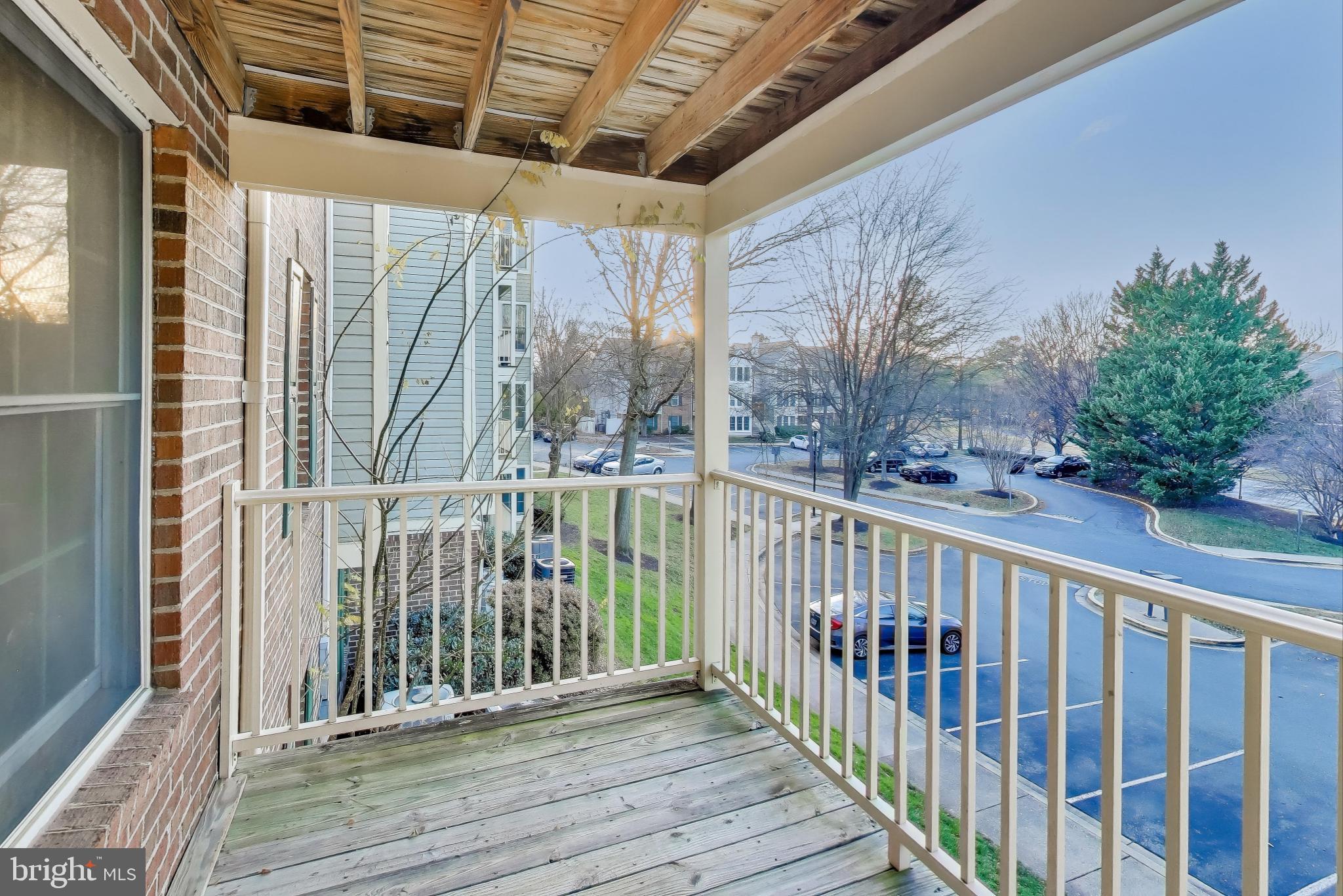 13107 Briarcliff Terrace, Unit 2204 Germantown, MD 20874 - Photo 26 of 30 a view of a balcony with wooden floor