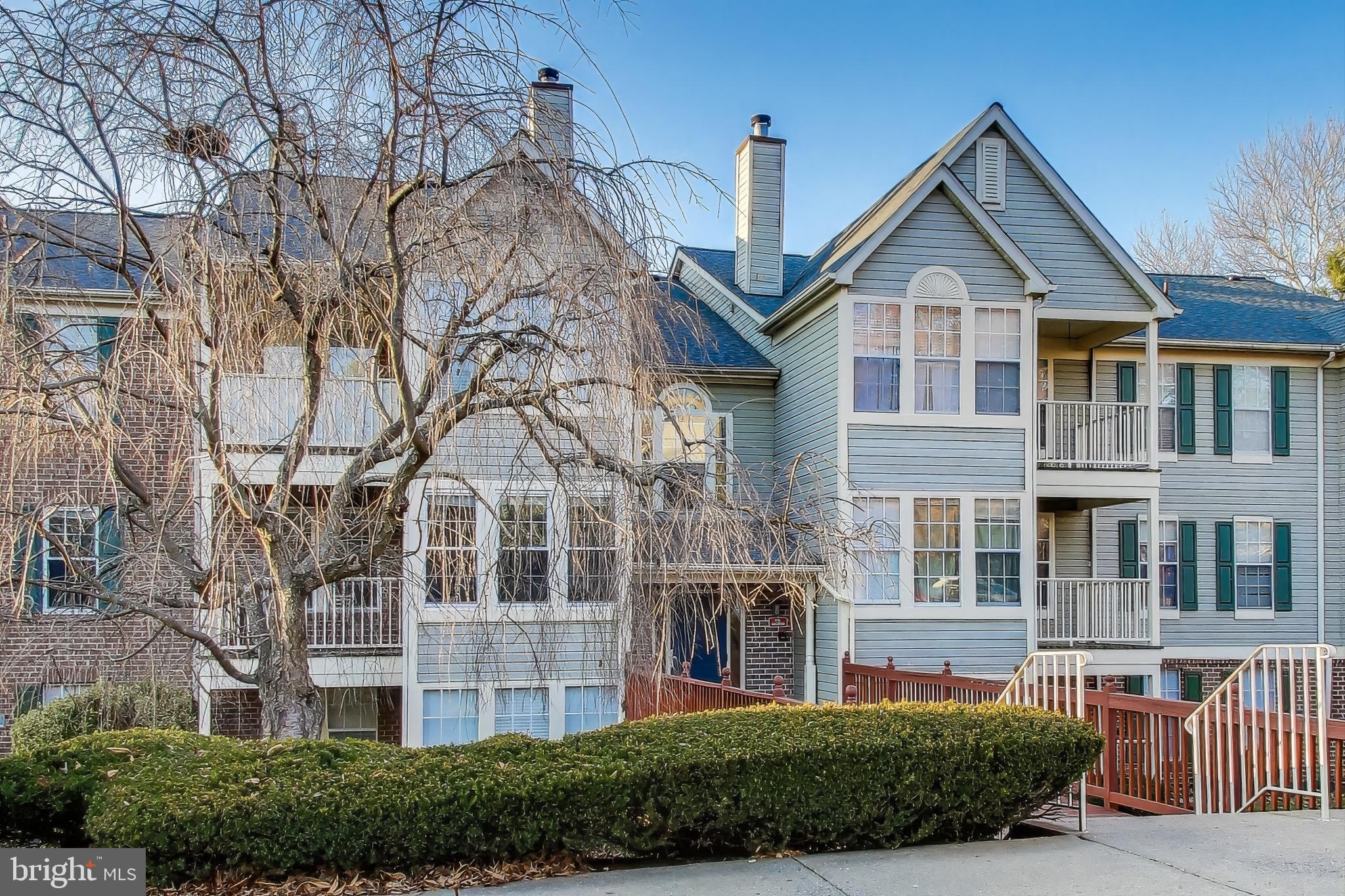 13107 Briarcliff Terrace, Unit 2204 Germantown, MD 20874 - Photo 3 of 30 a front view of a house with a yard