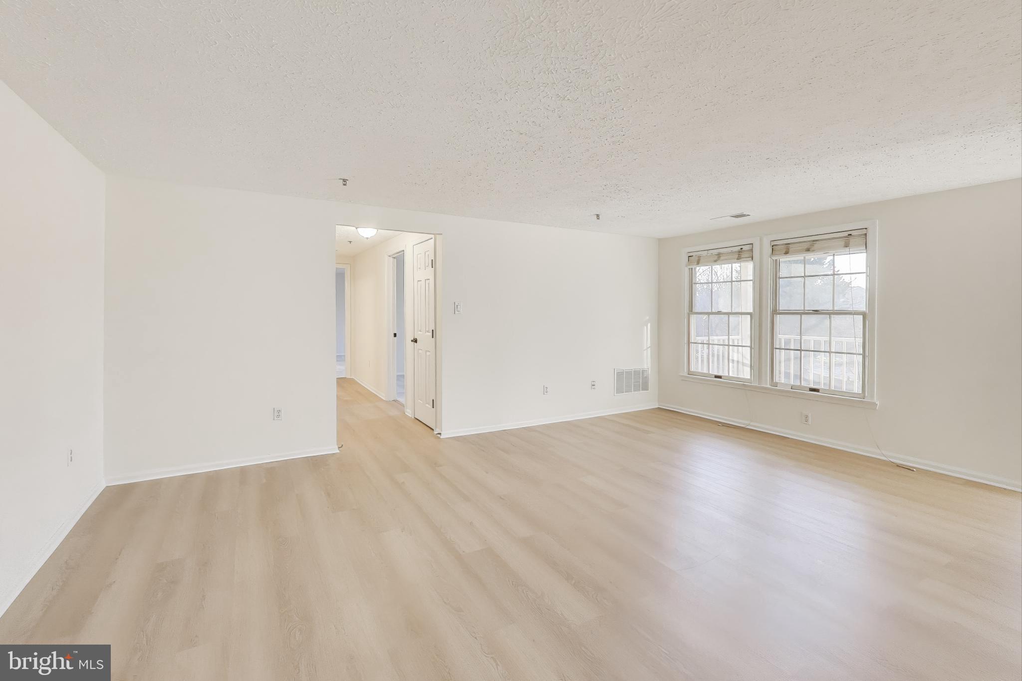13107 Briarcliff Terrace, Unit 2204 Germantown, MD 20874 - Photo 5 of 30 an empty room with windows and closet