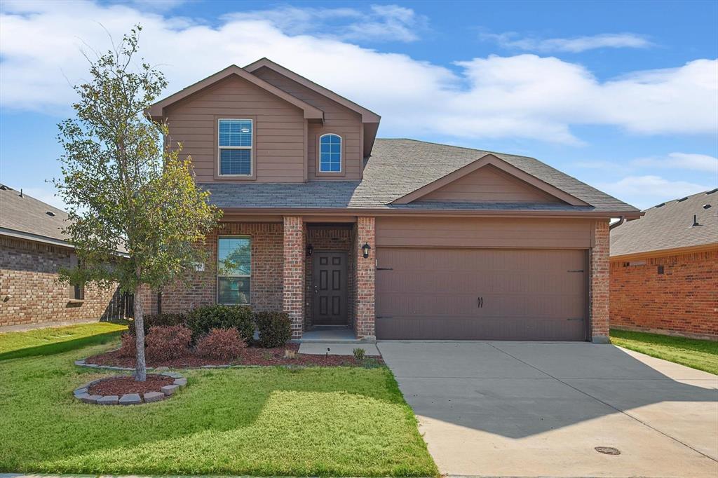 1117 Emerald Leaf Drive Azle, TX 76020 - Photo 1 of 40 a front view of house with yard and green space