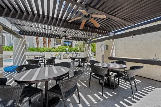 a outdoor dining space with furniture and outdoor seating