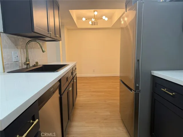 a view of a kitchen from the hallway