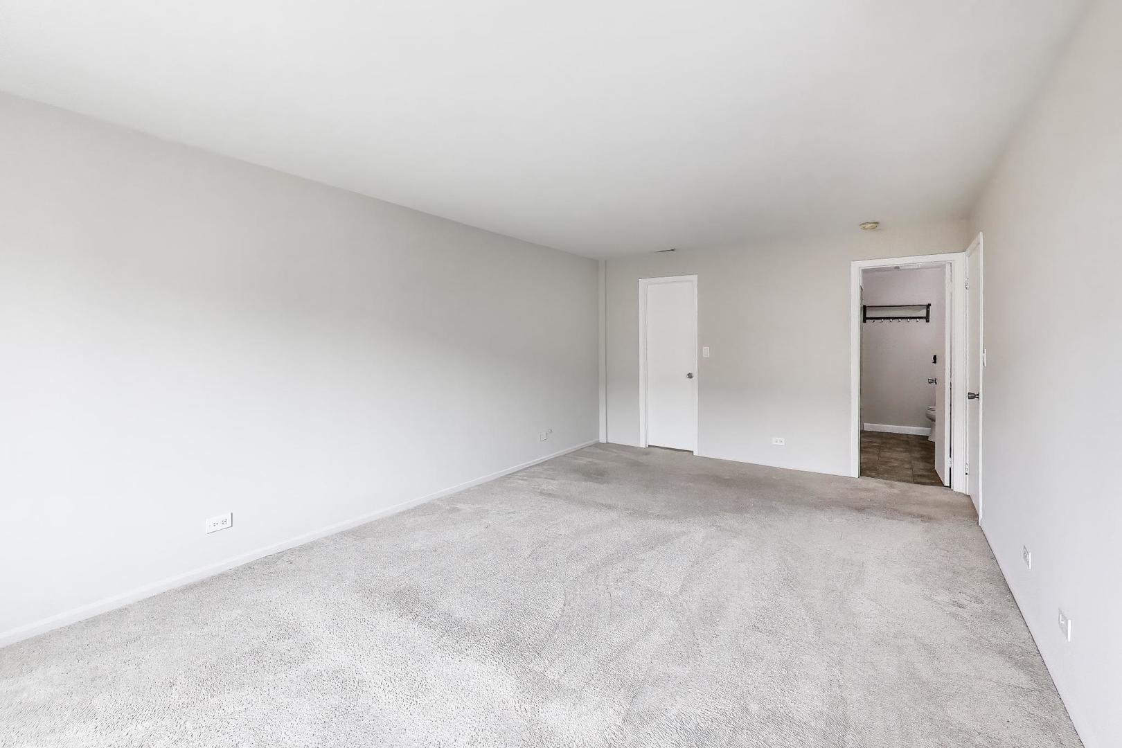 8610 Waukegan Road, Unit 302 Morton Grove, IL 60053 - Photo 20 of 34 a view of an empty room