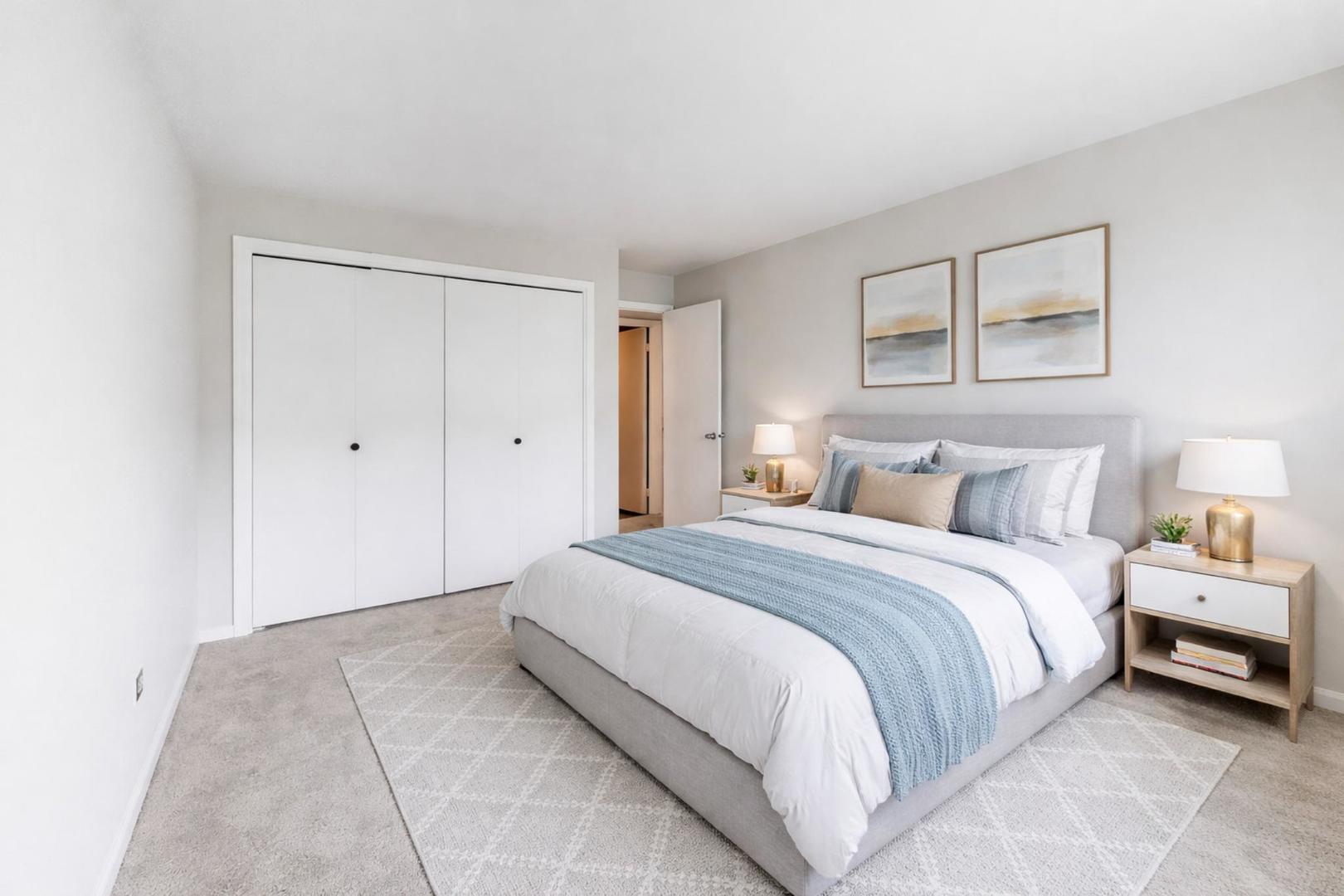 8610 Waukegan Road, Unit 302 Morton Grove, IL 60053 - Photo 27 of 34 a spacious bedroom with a bed and a window