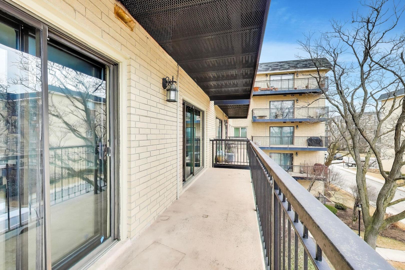 8610 Waukegan Road, Unit 302 Morton Grove, IL 60053 - Photo 30 of 34 a view of a balcony with furniture