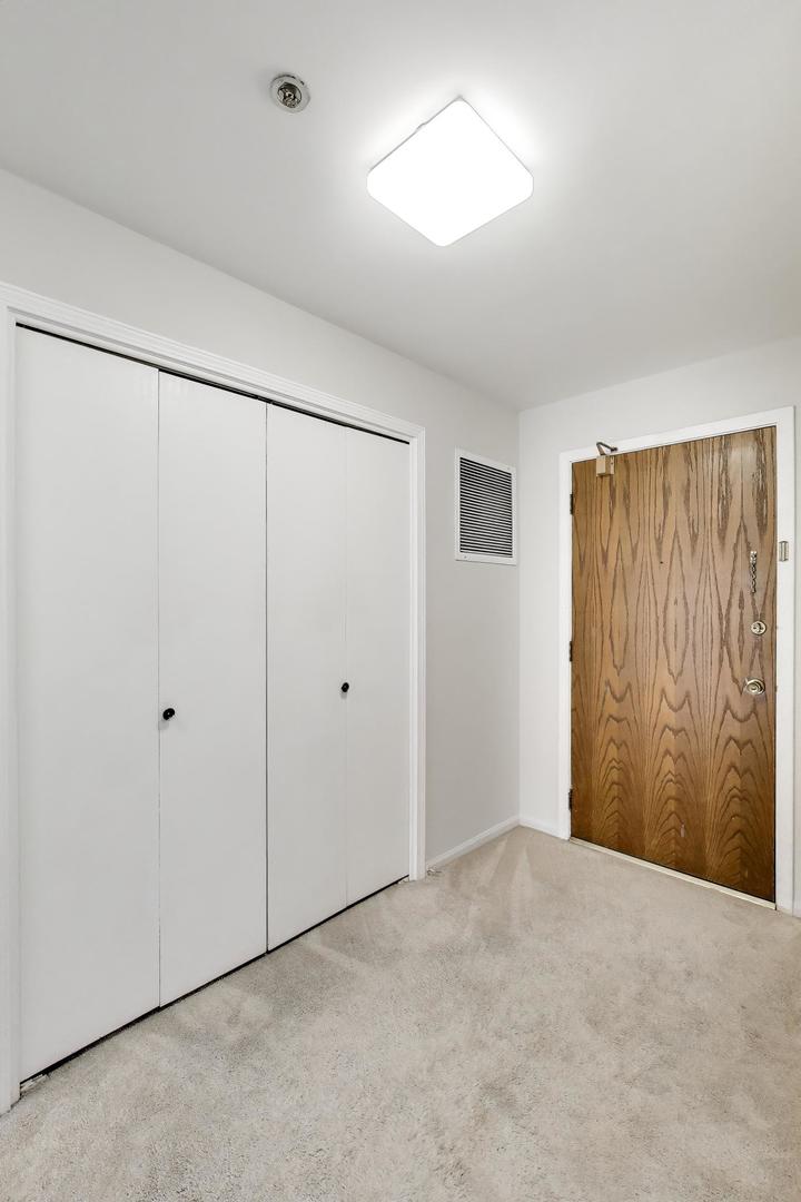 8610 Waukegan Road, Unit 302 Morton Grove, IL 60053 - Photo 3 of 34 a view of an empty room
