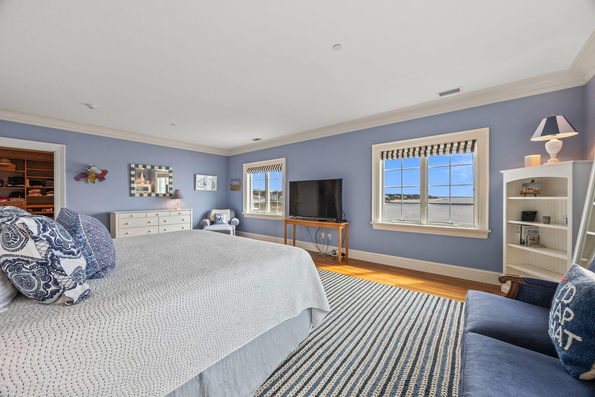 23 Snow Inn Road, Unit 8 Harwich Port, MA 02646 - Photo 33 of 100 a spacious bedroom with a bed and a couch