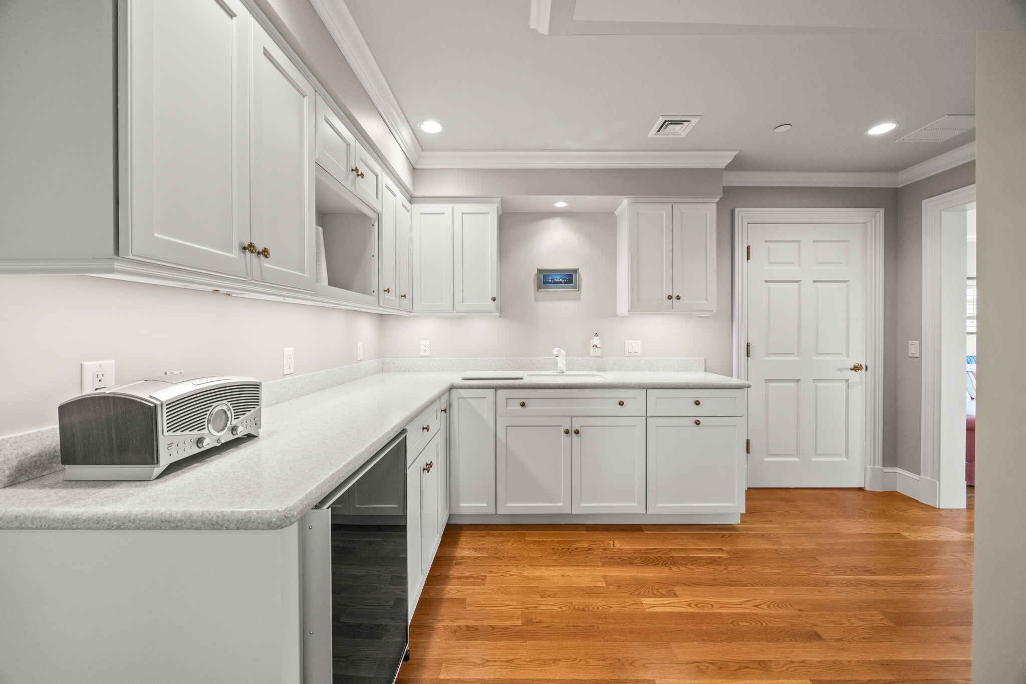 23 Snow Inn Road, Unit 8 Harwich Port, MA 02646 - Photo 56 of 100 a kitchen with granite countertop a sink a stove and cabinets
