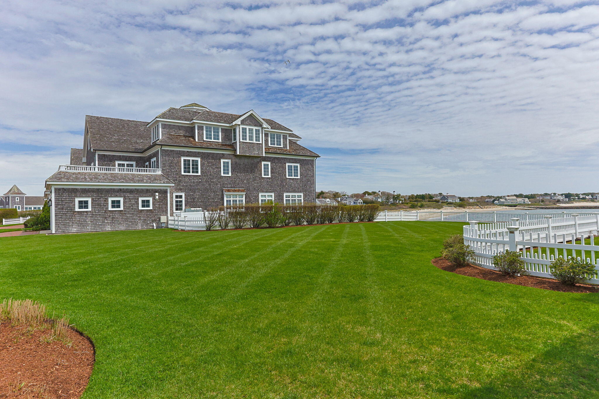 23 Snow Inn Road, Unit 8 Harwich Port, MA 02646 - Photo 77 of 100 a view of a big house with a big yard