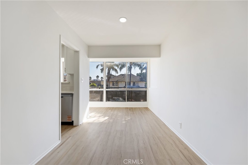 505 Cedar Avenue, Unit 2A Long Beach, CA 90802 - Photo 54 of 71 an empty room with wooden floor and windows