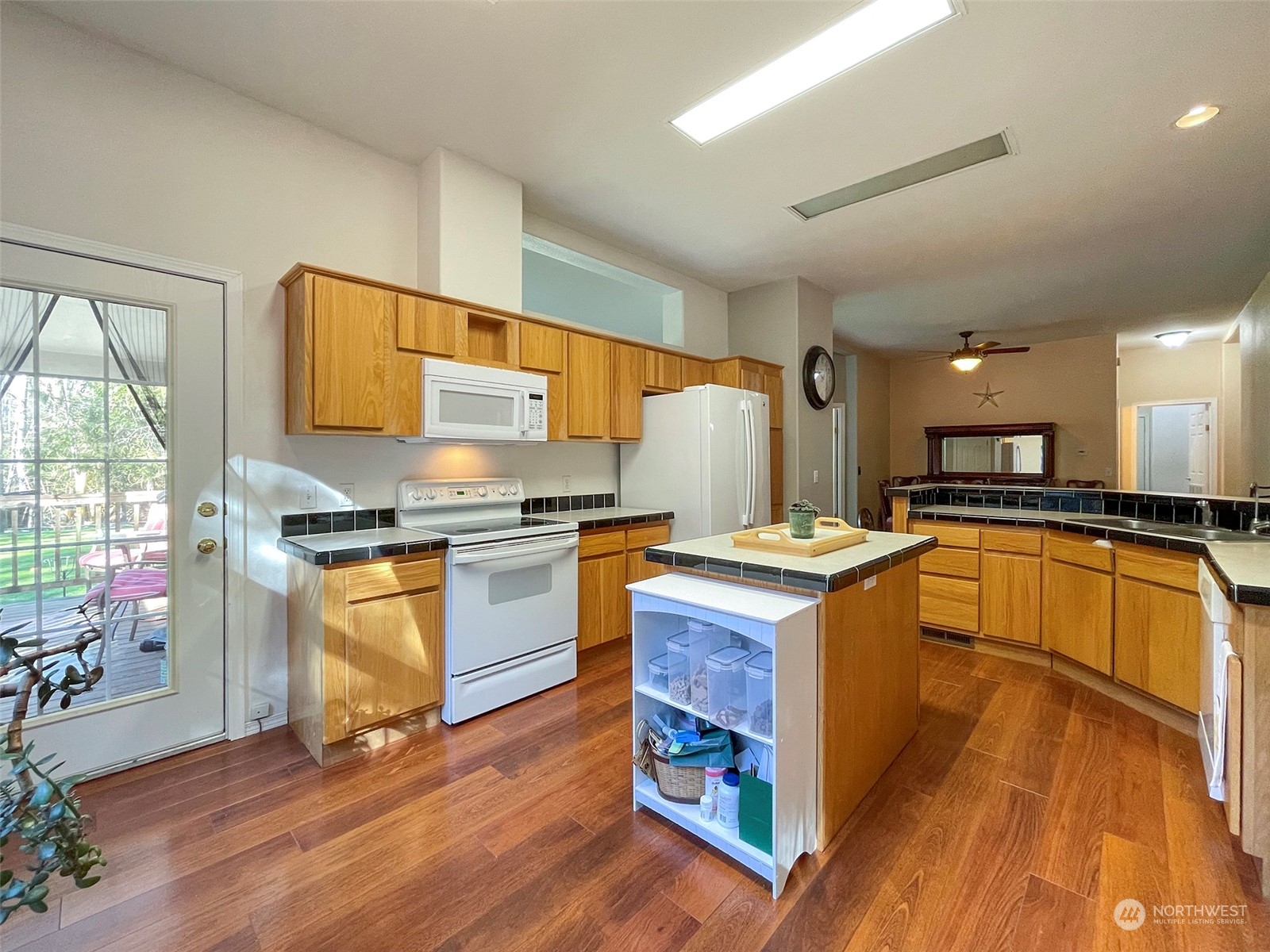 297 Amarillo Road Port Angeles, WA 98362 - Photo 12 of 40 a kitchen with stainless steel appliances granite countertop a stove top oven and a refrigerator
