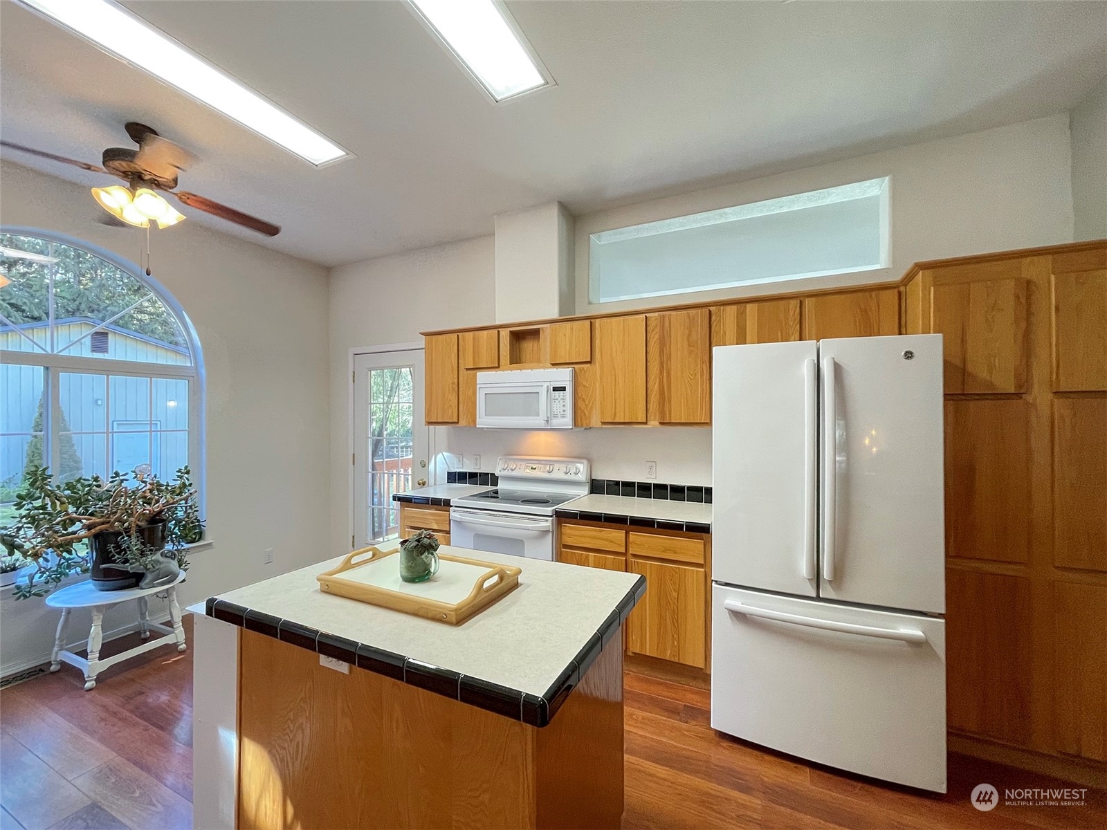 297 Amarillo Road Port Angeles, WA 98362 - Photo 14 of 40 a kitchen with a appliances a refrigerator and a stove top oven