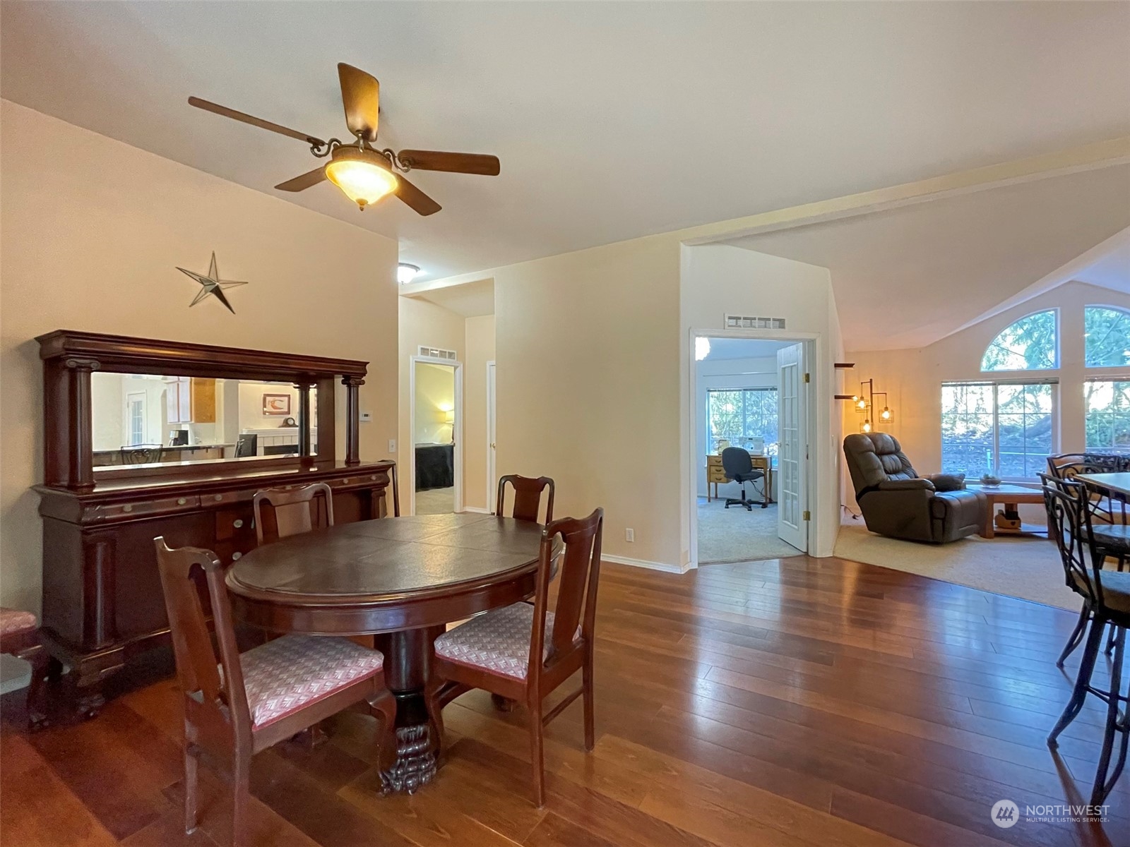 297 Amarillo Road Port Angeles, WA 98362 - Photo 16 of 40 a dining room with furniture a chandelier and wooden floor